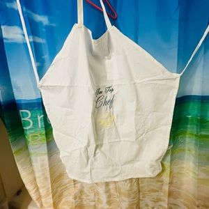 White apron with embroidery on it